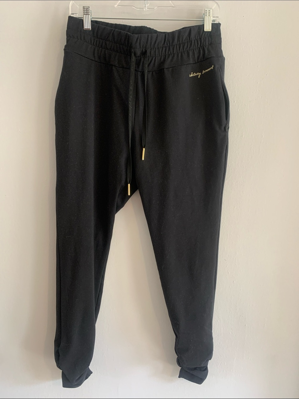 GYMSHARK Black Jogger Pants with Gold Accents